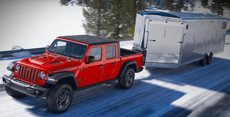 Red Jeep Gladiator Towing Trailer